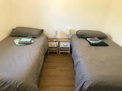 Un ou plusieurs lits dans un hébergement de l'établissement Maison face aux îles de Melon, Molène et Ouessant 6P