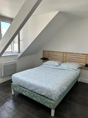 Un ou plusieurs lits dans un hébergement de l'établissement Apartment La Fontaine