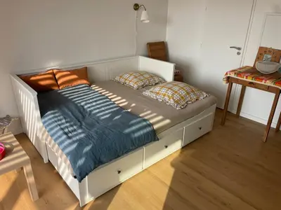 Un ou plusieurs lits dans un hébergement de l'établissement Appartement bord de mer